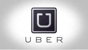 The logo for the ride sharing service Uber, stylized on a gray background.